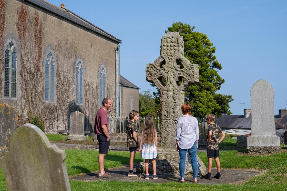 Family at one of Kells' High Crosses