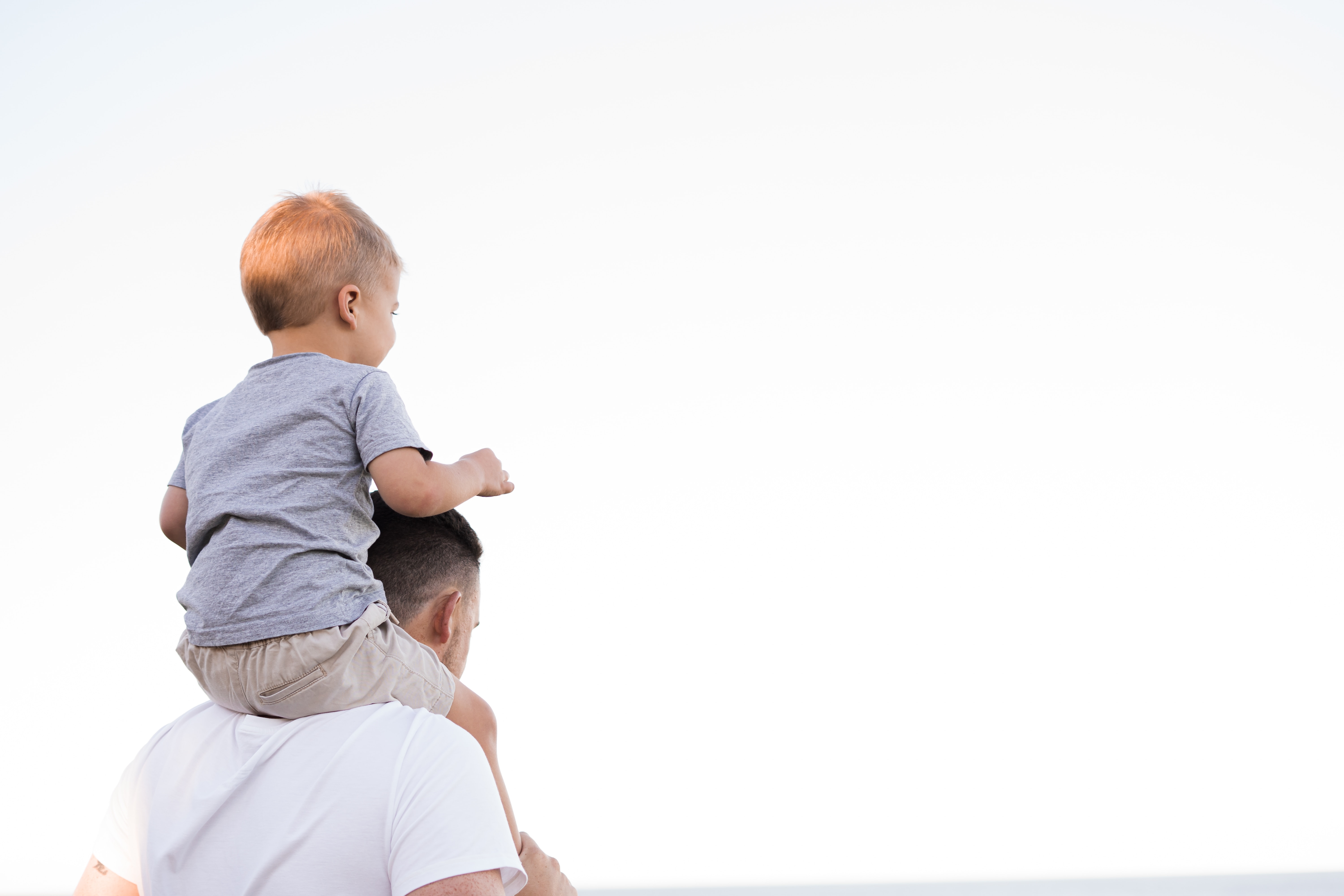 Father with son on his shoulders