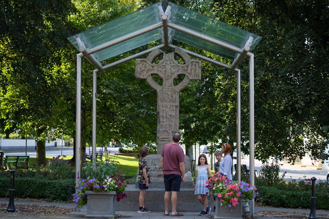 Family at one of Kells' High Crosses